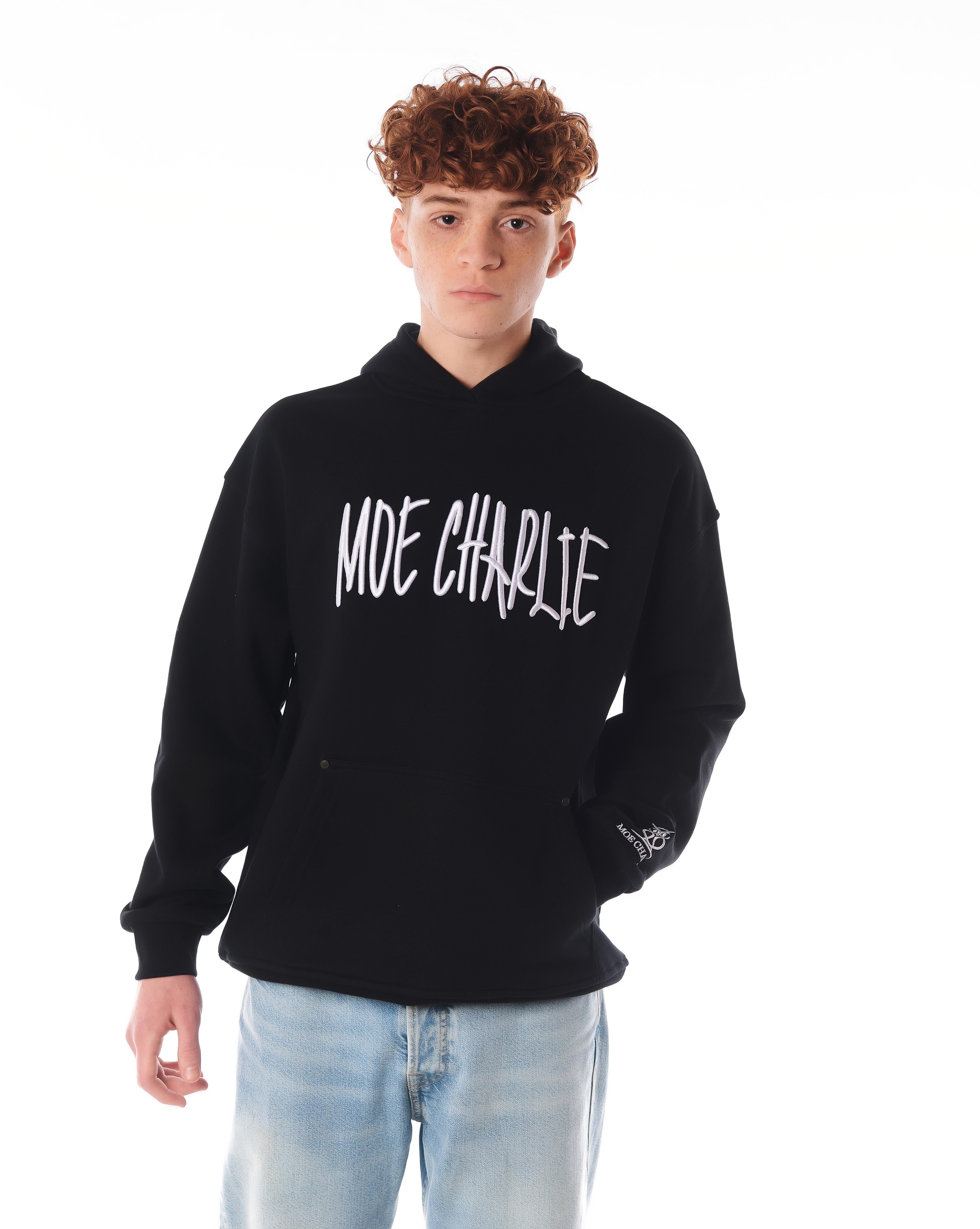 Night Life Hoodie von MOE CHARLIE, Frontpose in Schwarz mit großem weißem Graffiti-Schriftzug auf der Brust